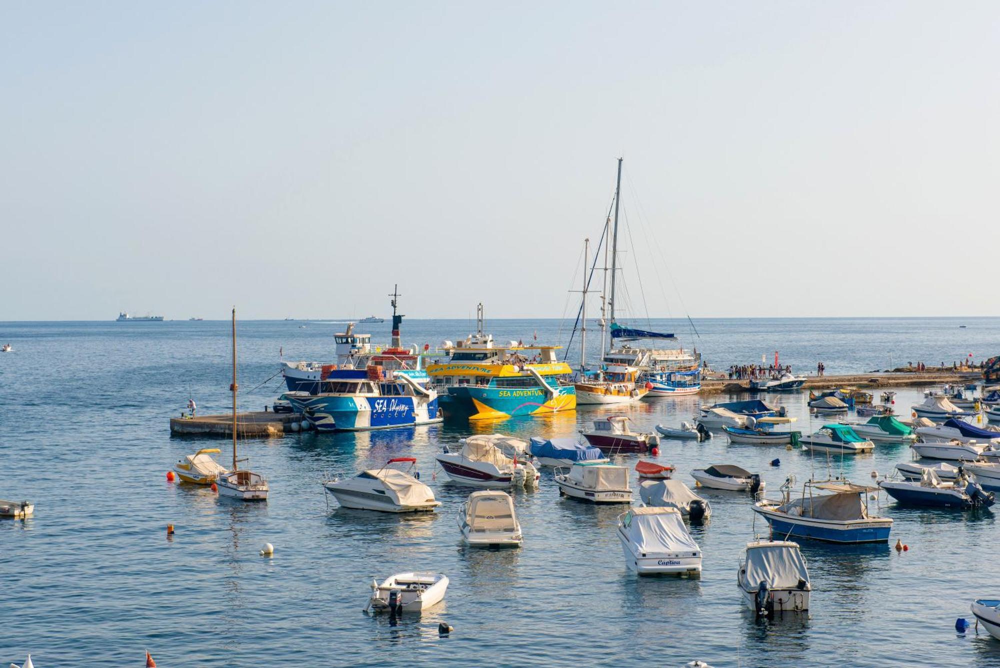 Islet Promenade Seafront With Large Corner Terrace By Getawaysmalta *