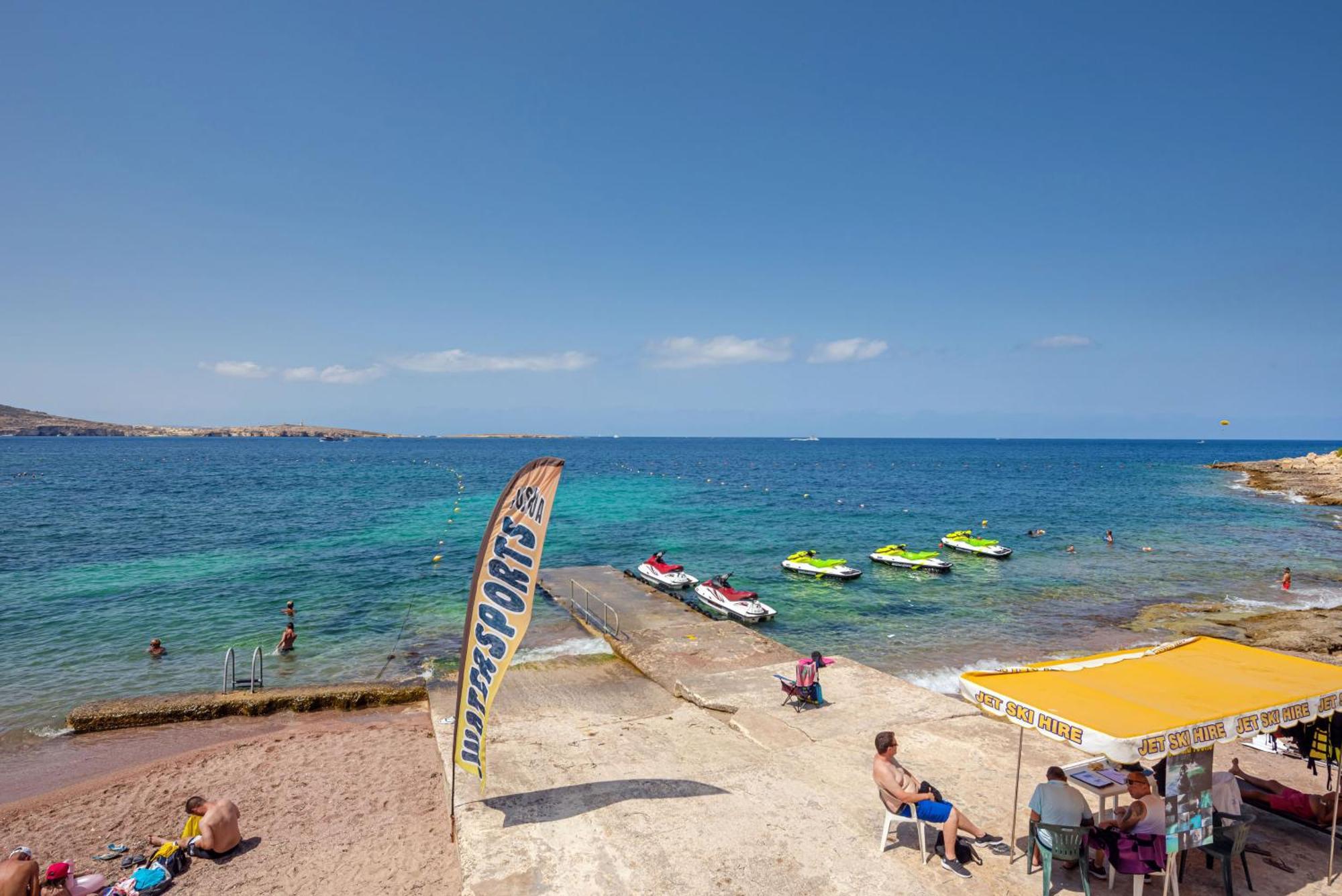 Islet Promenade Seafront With Large Corner Terrace By Getawaysmalta *