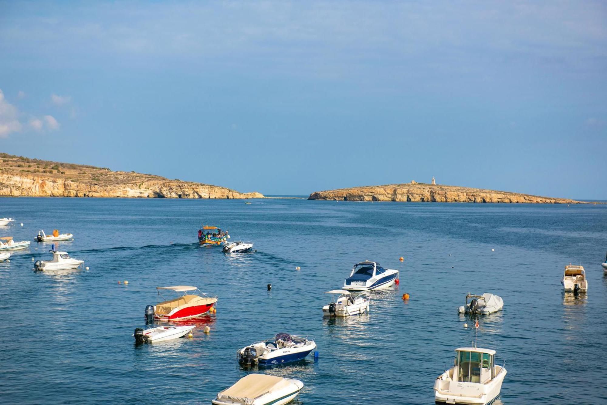 Islet Promenade Seafront With Large Corner Terrace By Getawaysmalta